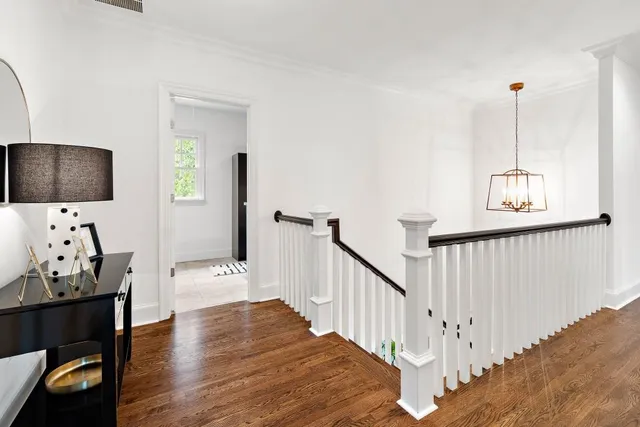 a en suite bathroom with a granite countertop sink and a mirror