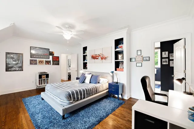 a bed room with a bed and a chandelier