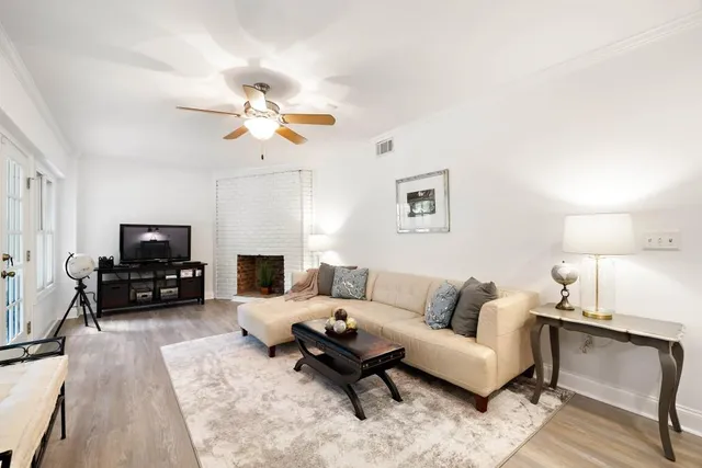 a view of an white house with a swimming pool