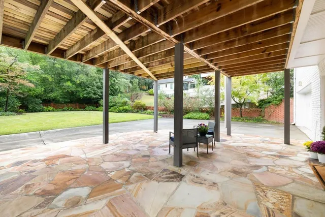 an aerial view of a house with outdoor space
