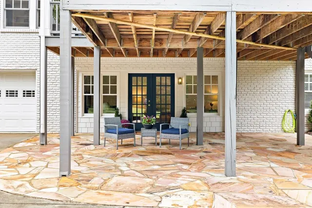 an aerial view of a house with a yard basket ball court and outdoor seating