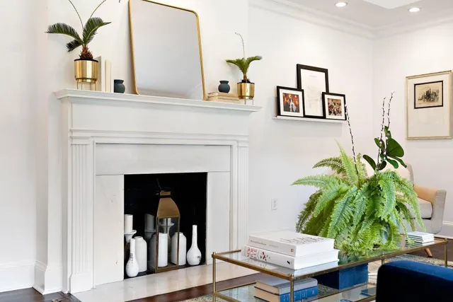 a living room with furniture and a fireplace