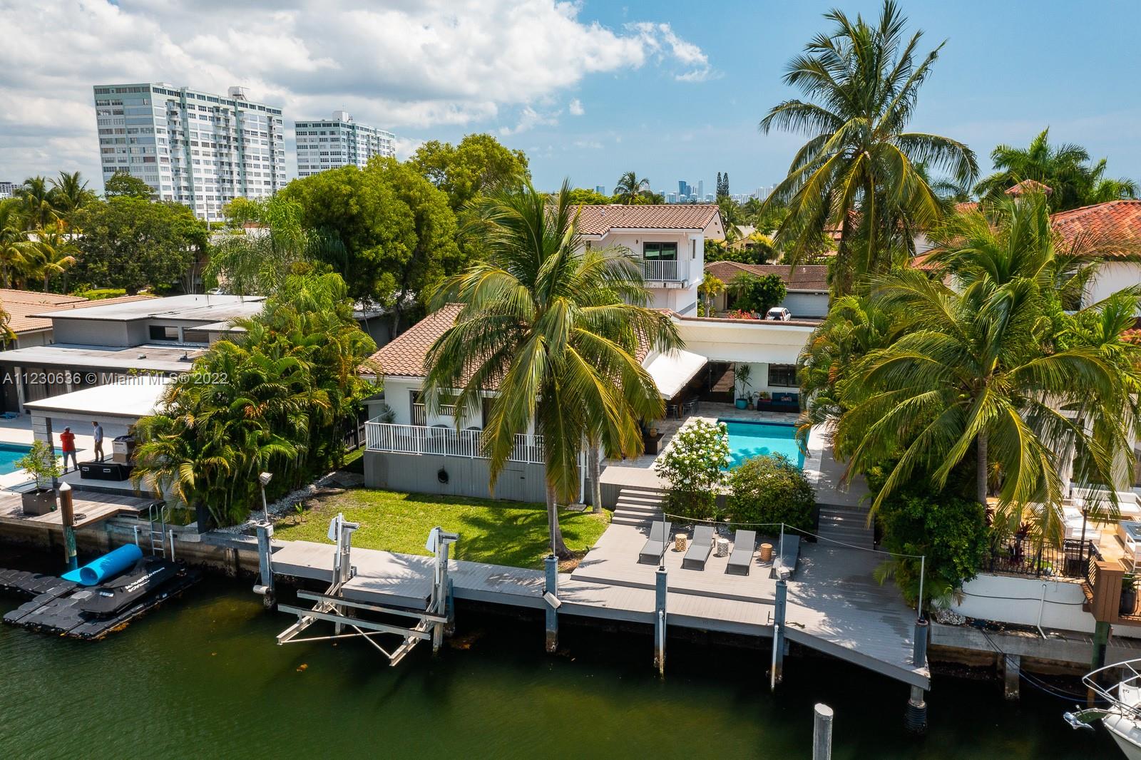 1922 Northeast 119th Road North Miami, FL 33181 - Photo 1 of 42 a view of a swimming pool with a patio