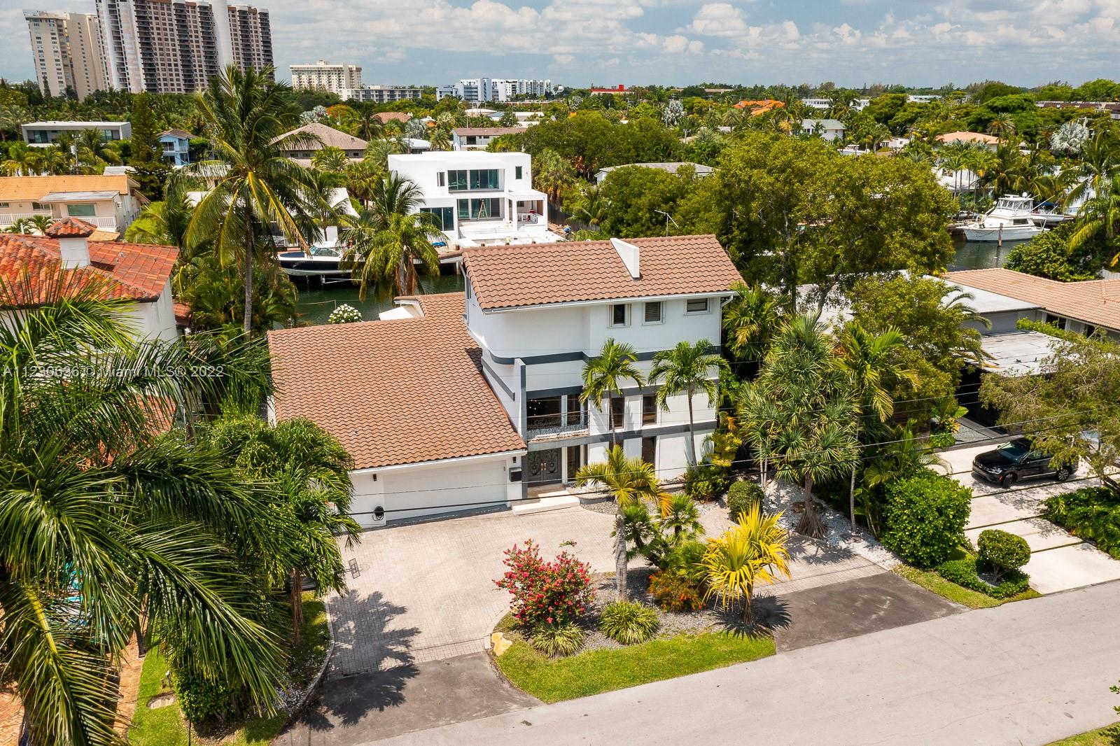 1922 Northeast 119th Road North Miami, FL 33181 - Photo 2 of 42 an aerial view of a house with a yard