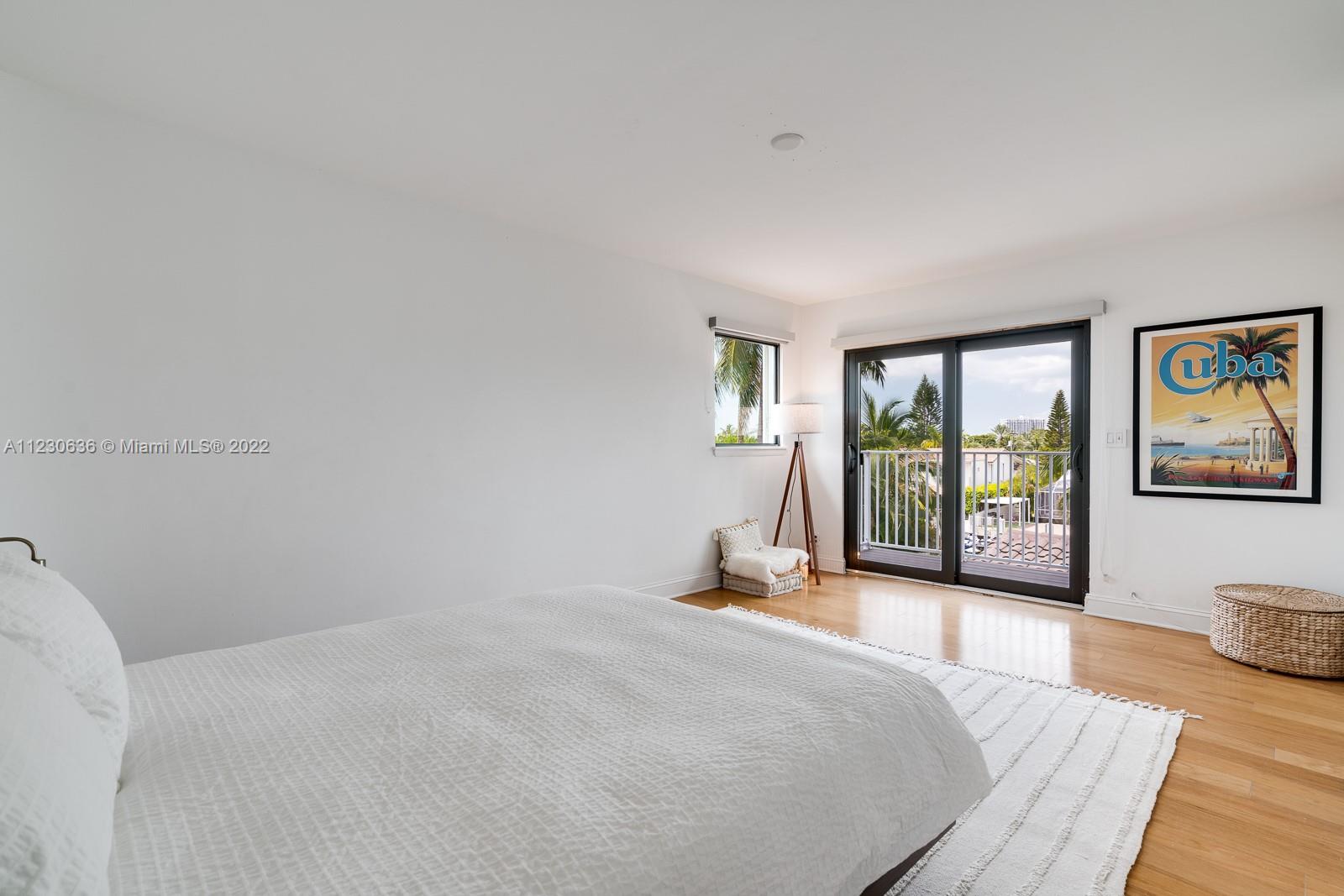 1922 Northeast 119th Road North Miami, FL 33181 - Photo 24 of 42 a bedroom with a bed and a large window