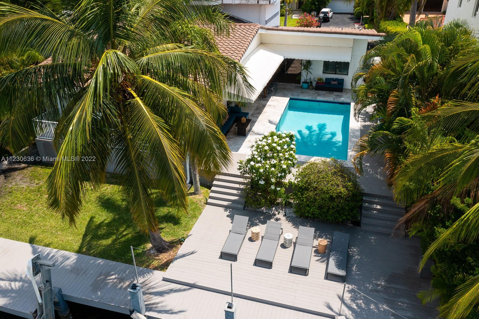 1922 Northeast 119th Road North Miami, FL 33181 - Photo 33 of 42 a view of backyard with plants and outdoor seating