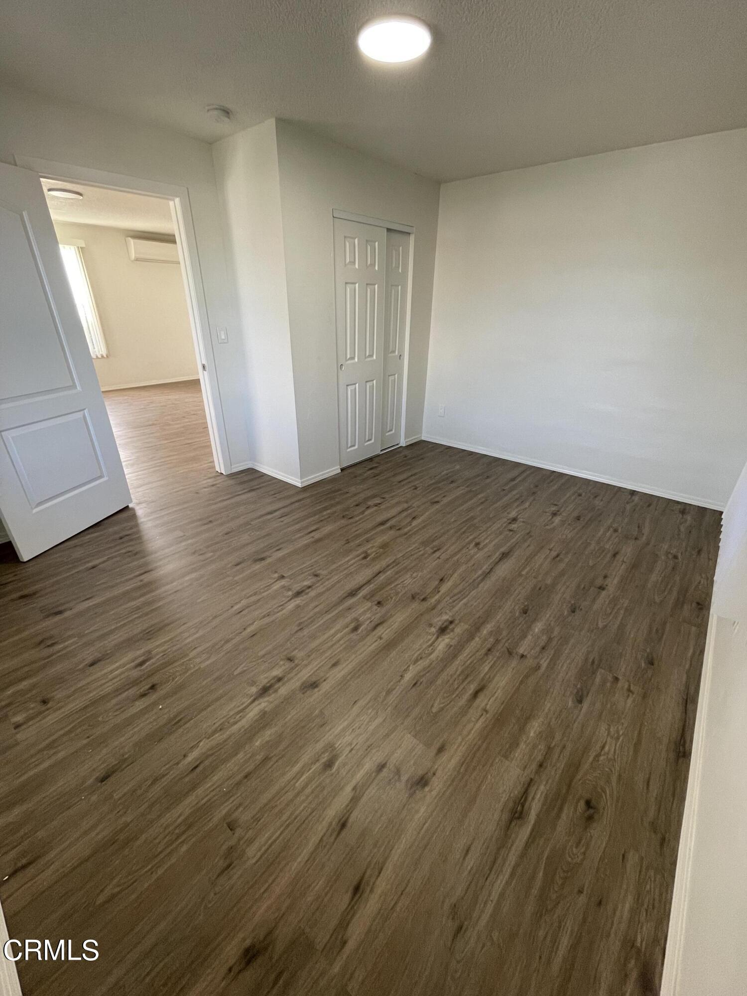 218 Wolff Street Oxnard, CA 93033 - Photo 7 of 12 wooden floor in an empty room