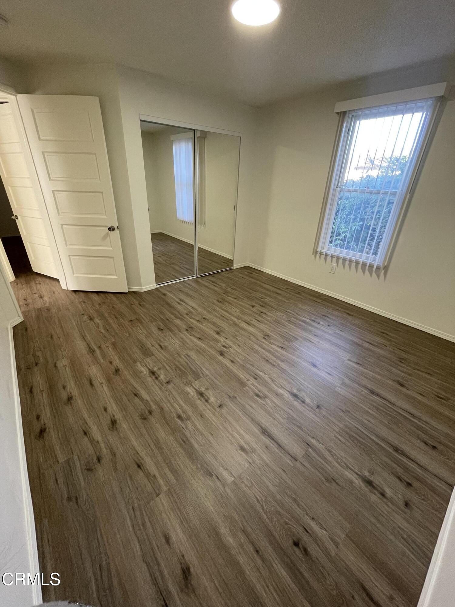 218 Wolff Street Oxnard, CA 93033 - Photo 8 of 12 wooden floor in an empty room