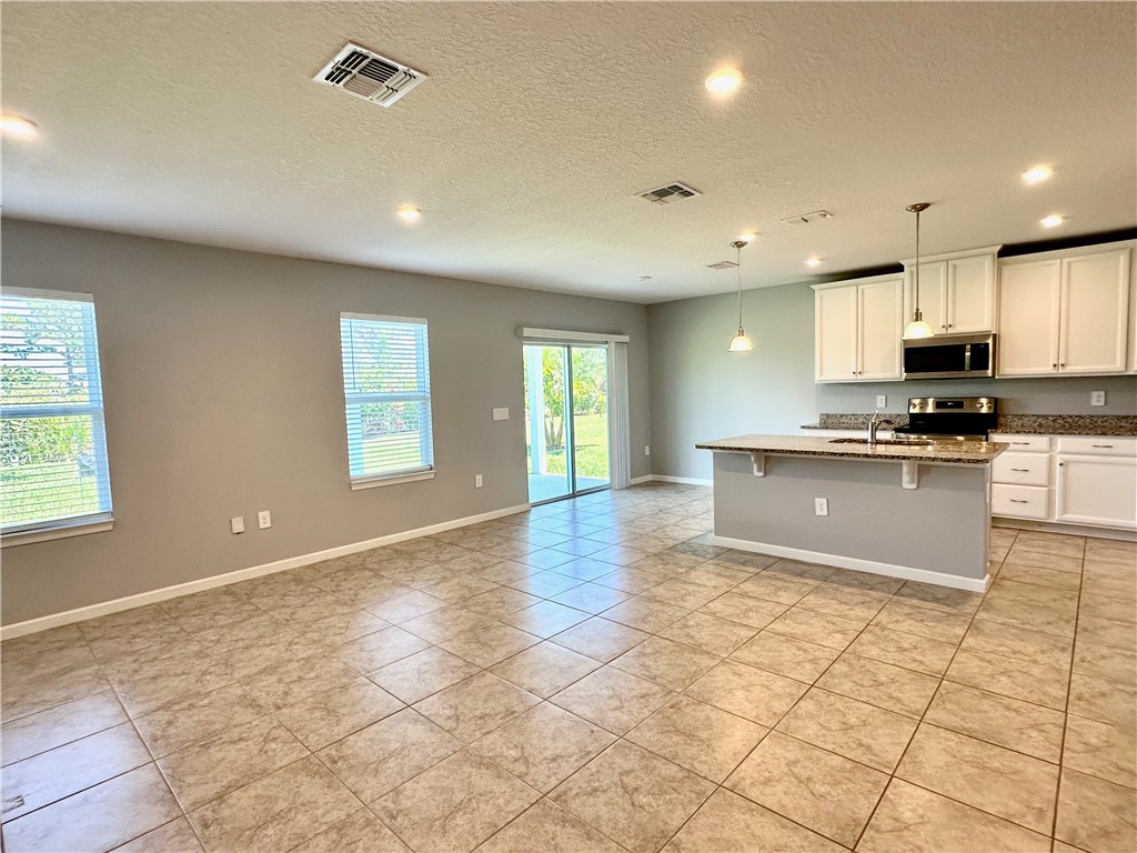 4173 Keeson Circle Vero Beach, FL 32967 - Photo 11 of 24 a view of kitchen with windows