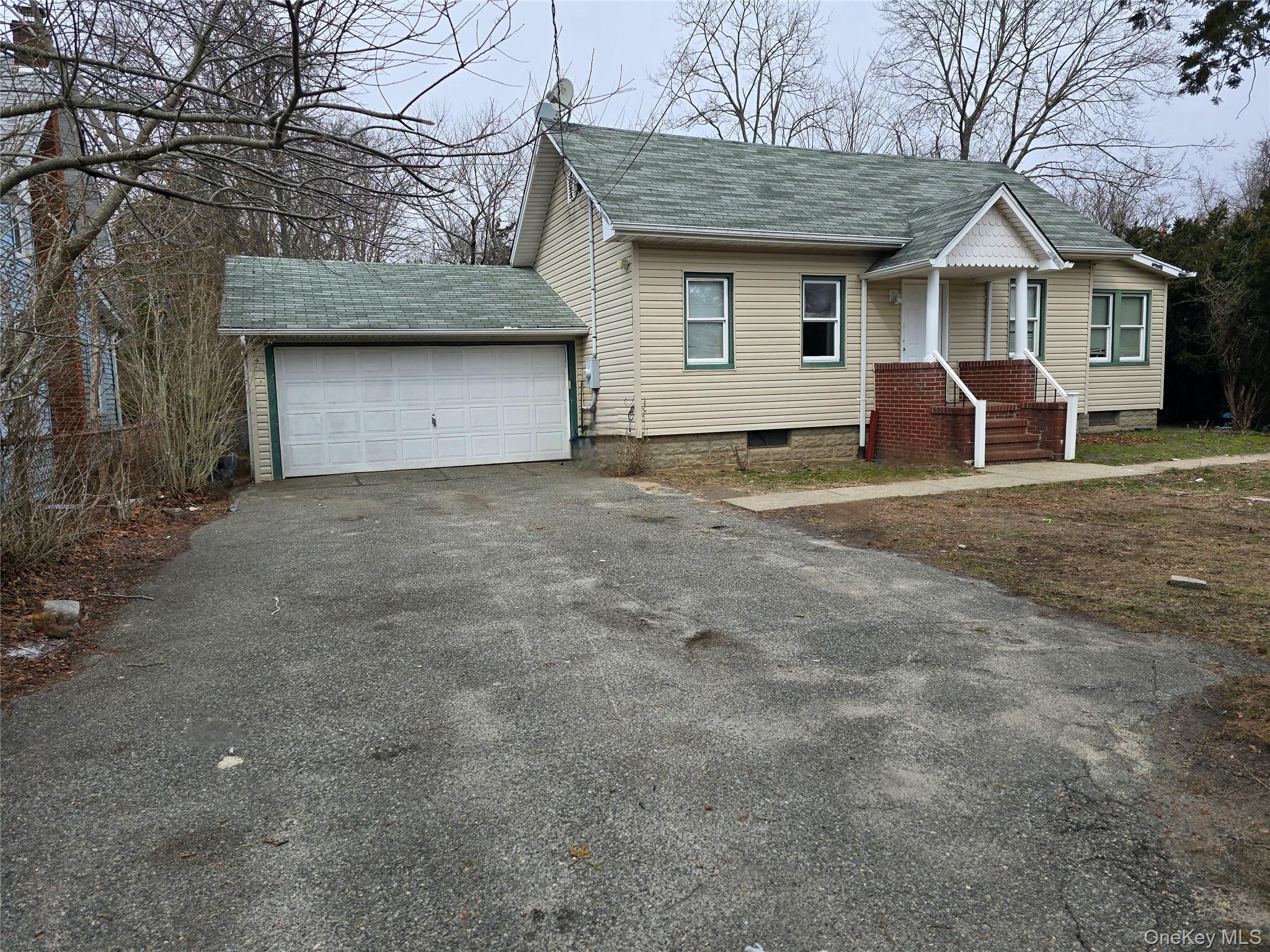 5 Cedar Road East Mastic Beach, NY 11951 - Photo 3 of 4 a view of a house with a yard and large tree