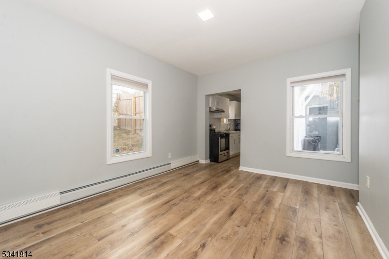 93 Front Street, Unit 2 Paterson, NJ 07522 - Photo 4 of 12 an empty room with windows
