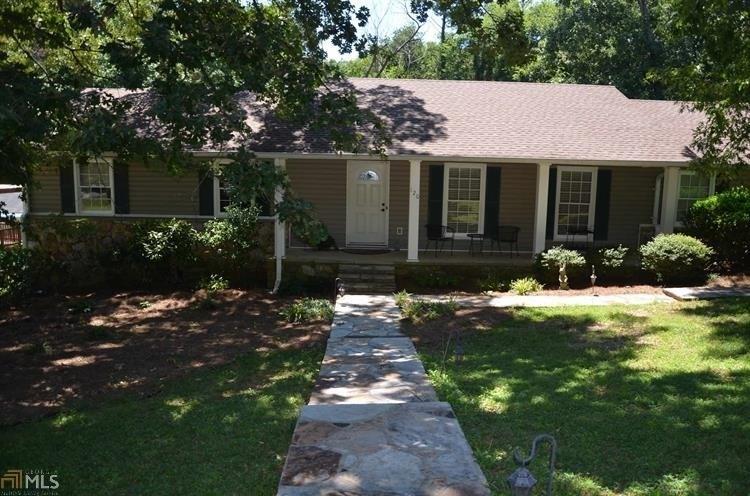 120 Margo Trail Southeast Rome, GA 30161 - Photo 1 of 1 a front view of a house with a yard and potted plants