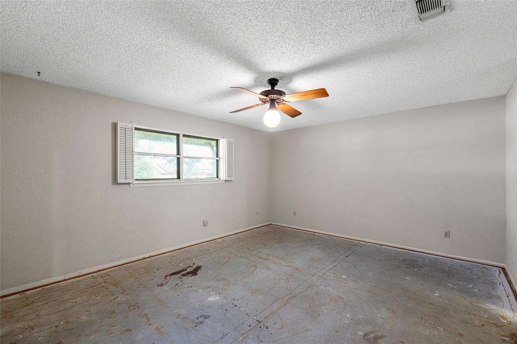 219 Opal Street Hewitt, TX 76643 - Photo 18 of 28 an empty room with windows and fan