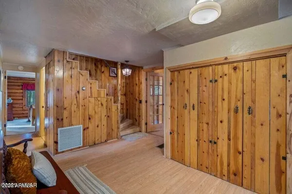 a view of a room with wooden walls