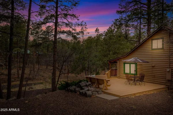 a view of a backyard with sitting area