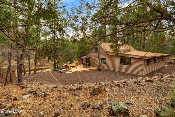 a backyard of a house with trees