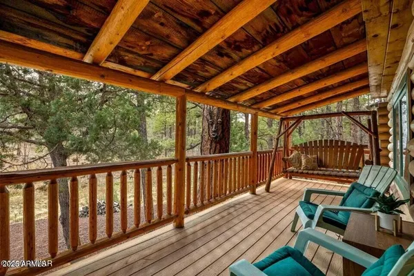 a view of porch with wooden floor