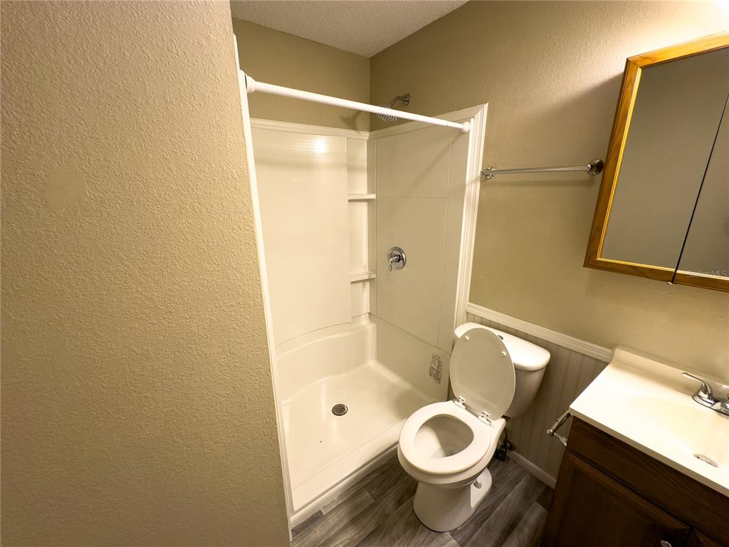17 Spring Loop Circle Ocala, FL 34472 - Photo 17 of 20 a bathroom with a granite countertop toilet and a shower