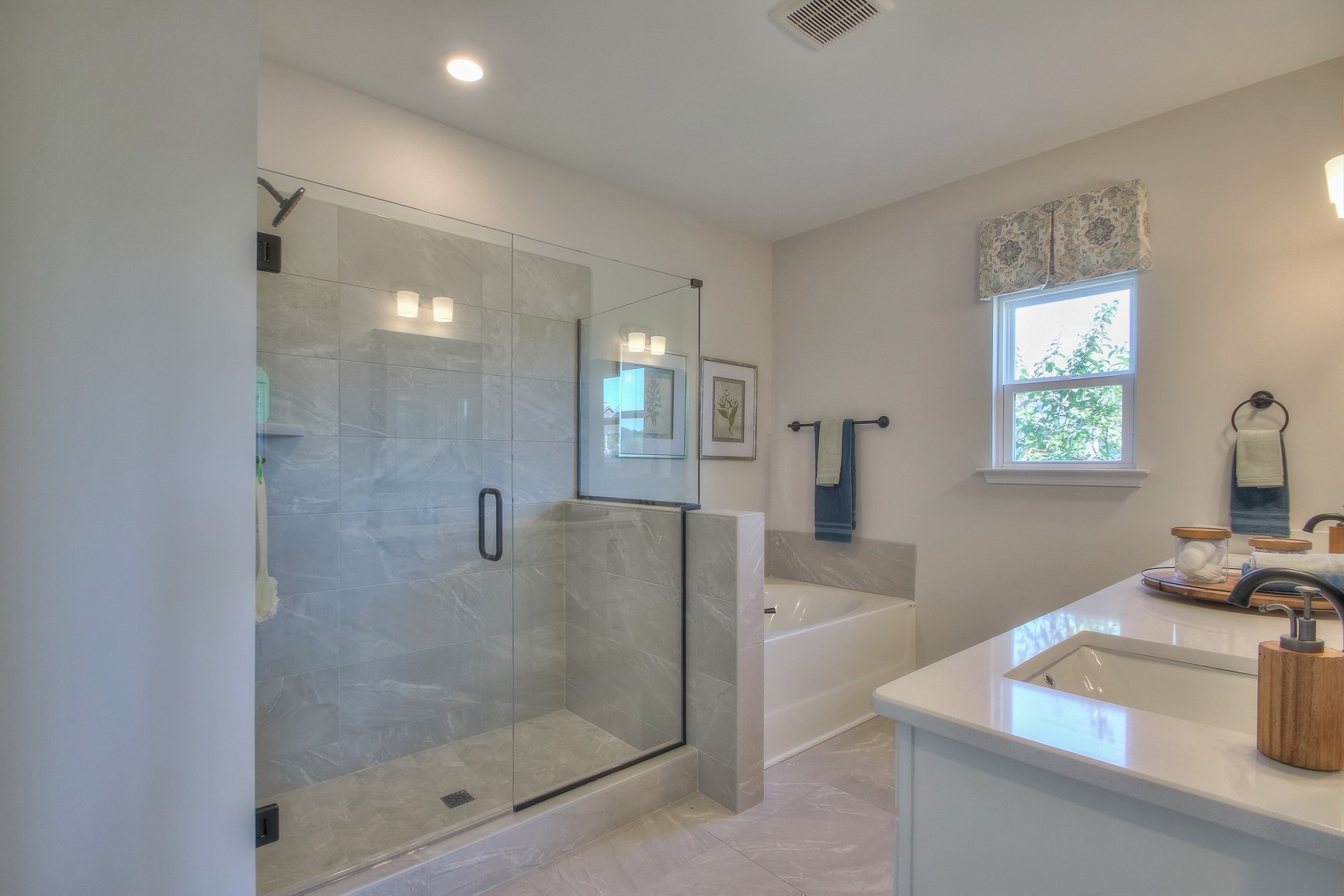 3117 Arbor Valley Rd Spring Hill Spring Hill, TN 37174 - Photo 15 of 21 a bathroom with a tub shower vanity and a sink