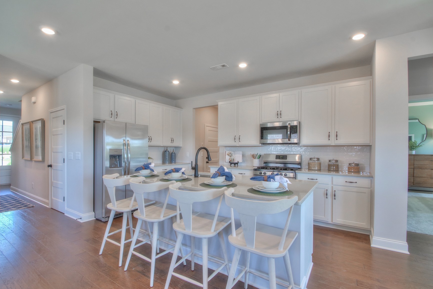 3117 Arbor Valley Rd Spring Hill Spring Hill, TN 37174 - Photo 8 of 21 a kitchen with kitchen island granite countertop a center island stainless steel appliances and cabinets