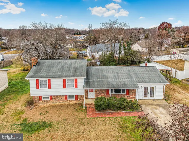 an aerial view of residential houses with a outdoor space