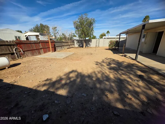 a view of a backyard of a house