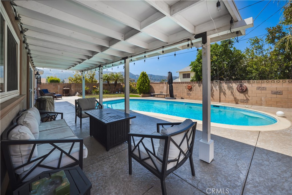 2203 Homewood Avenue Simi Valley, CA 93063 - Photo 32 of 37 a patio with a yard table and chairs