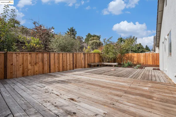 a view of basketball place with wooden fence