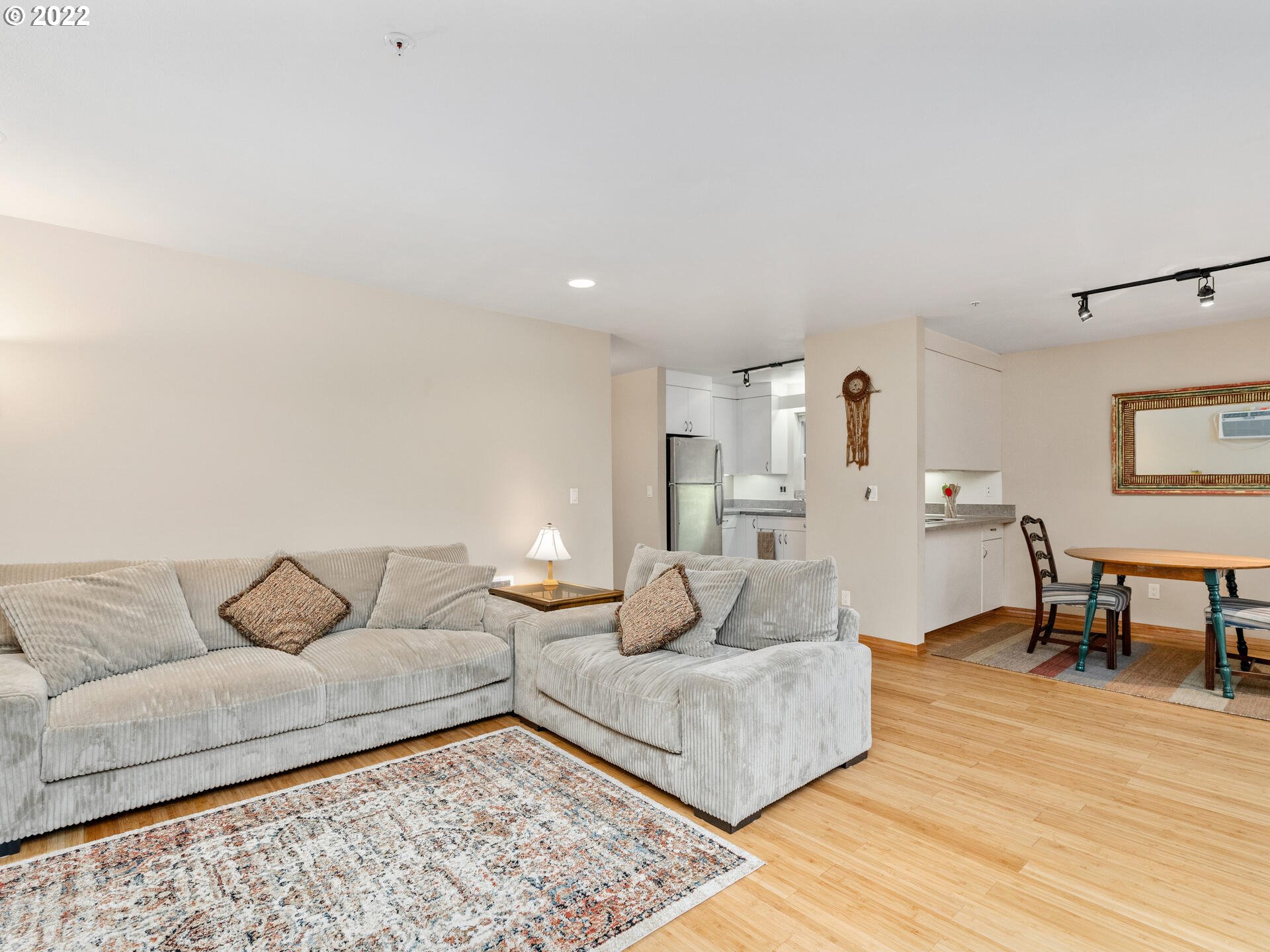 2709 Southwest 2nd Avenue, Unit 101 Portland, OR 97201 - Photo 12 of 25 a living room with furniture and a wooden floor