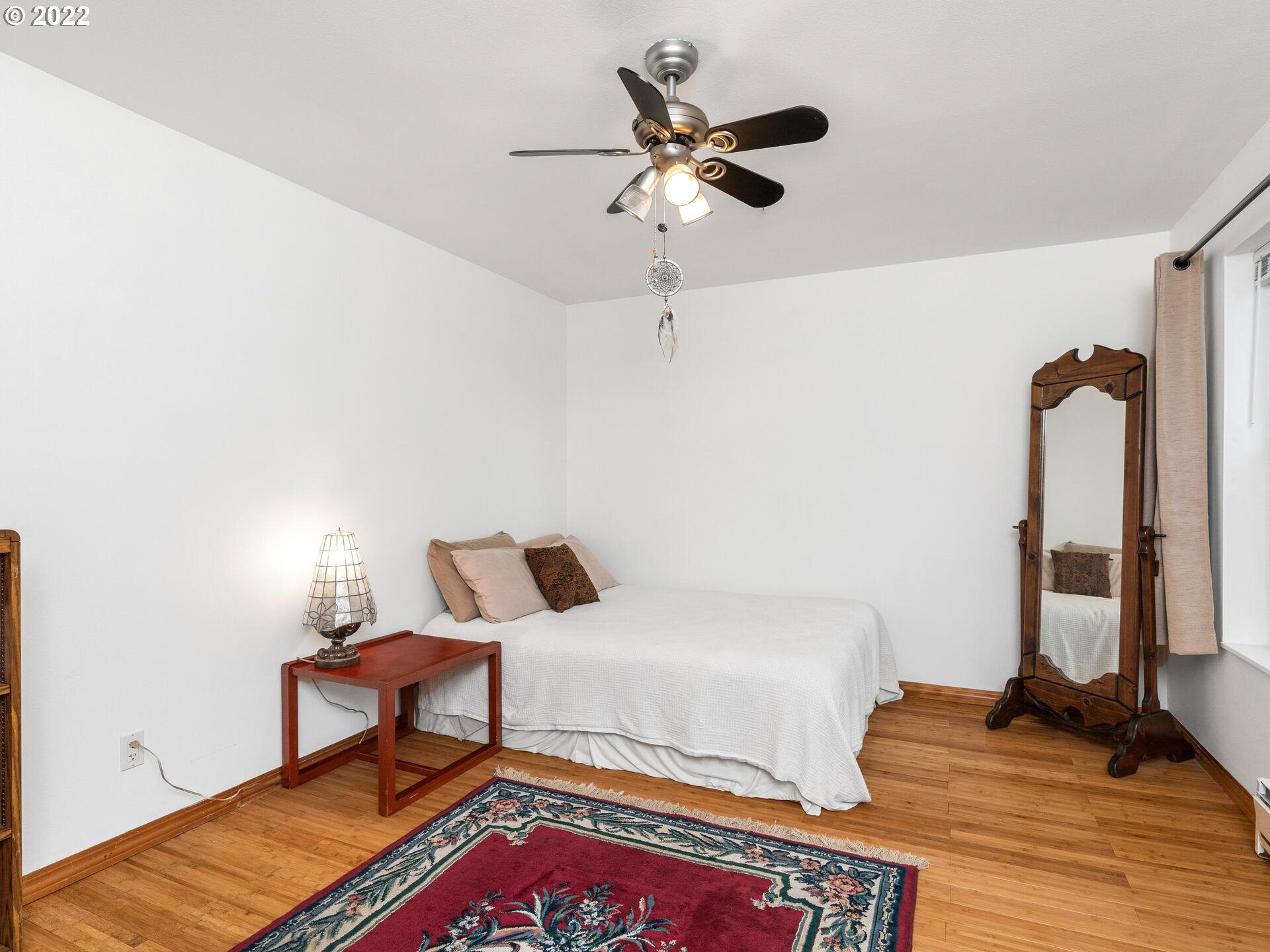 2709 Southwest 2nd Avenue, Unit 101 Portland, OR 97201 - Photo 14 of 25 a bedroom with a bed and a potted plant