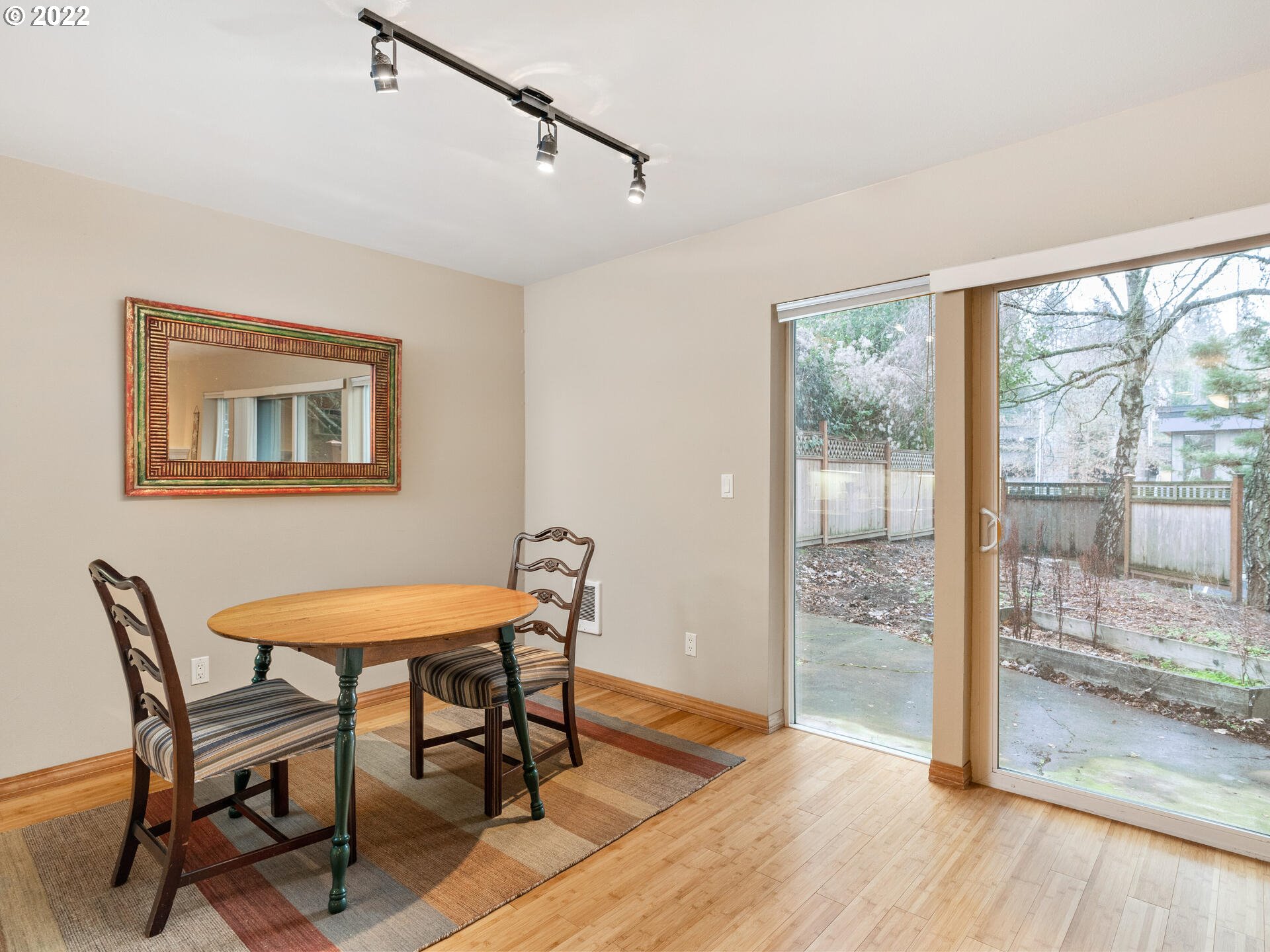 2709 Southwest 2nd Avenue, Unit 101 Portland, OR 97201 - Photo 8 of 25 a view of a room with furniture wooden floor and a floor to ceiling window