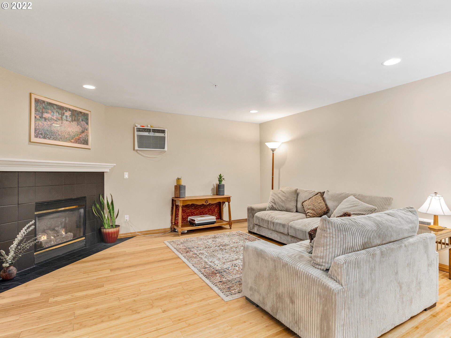 2709 Southwest 2nd Avenue, Unit 101 Portland, OR 97201 - Photo 10 of 25 a living room with furniture and a fireplace
