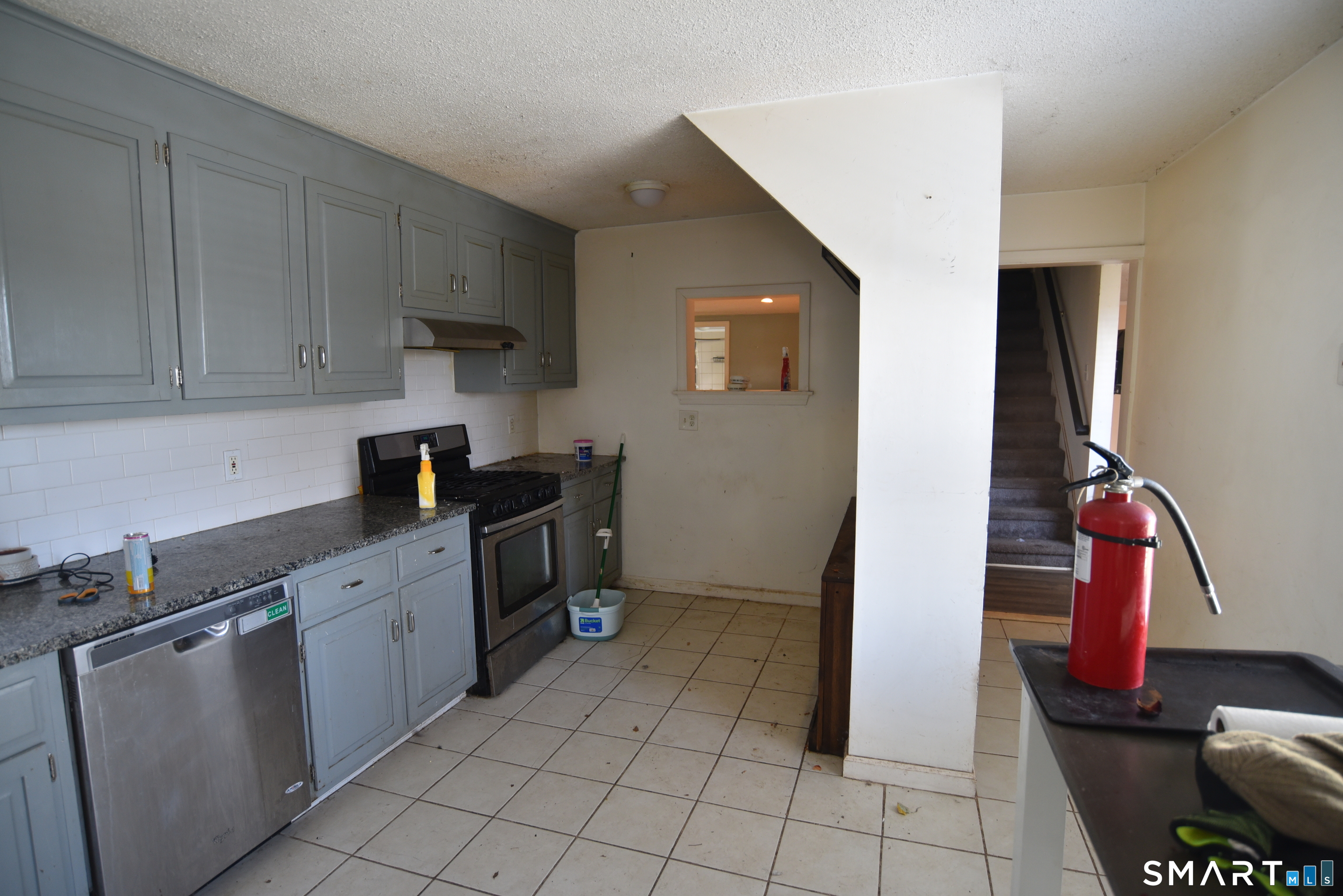 29 Bingham Street Bristol, CT 06010 - Photo 3 of 15 a kitchen with stainless steel appliances granite countertop a sink and cabinets