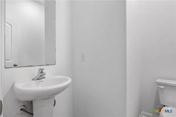 a bathroom with a sink and a toilet