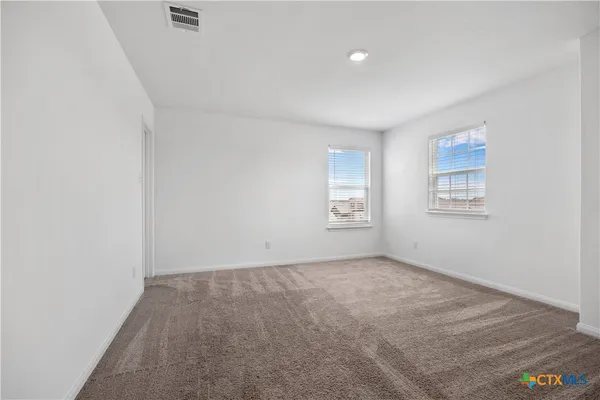 an empty room with windows