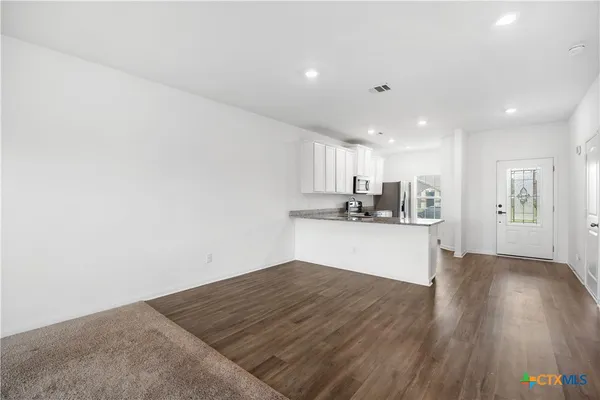 a view of kitchen with wooden floor