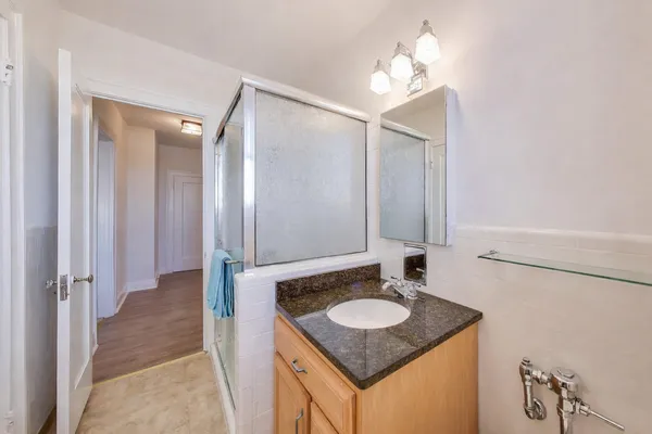 a bathroom with a sink and a mirror