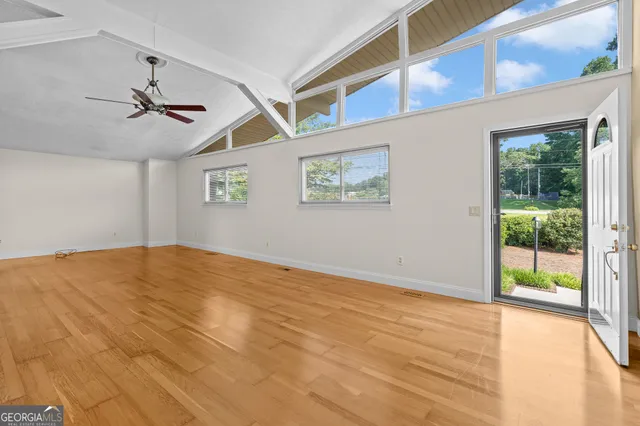 a view of a kitchen with a sink and refrigerator