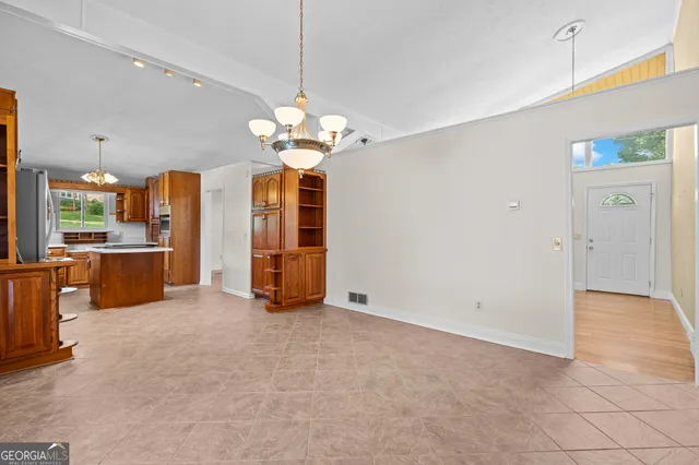 a kitchen that has a stove and a refrigerator