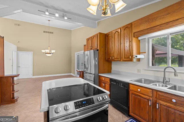 a view of empty room with floor to ceiling windows