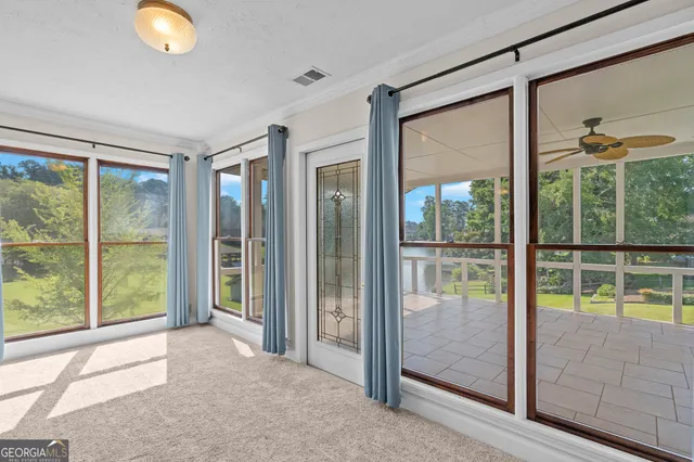 a view of room with window and ceiling fan