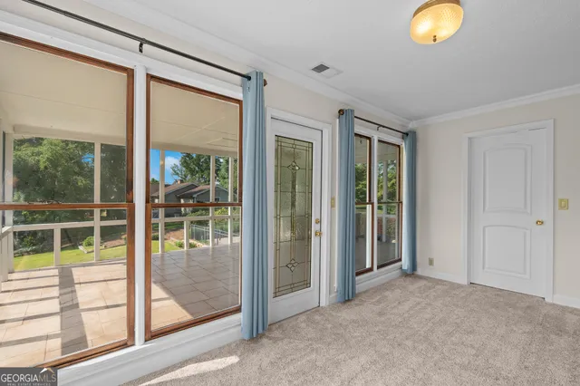 a view of room with window and ceiling fan