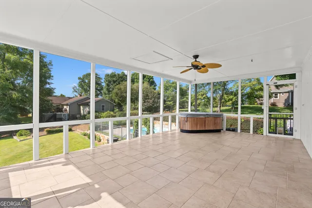 a view of a livingroom with furniture and a window
