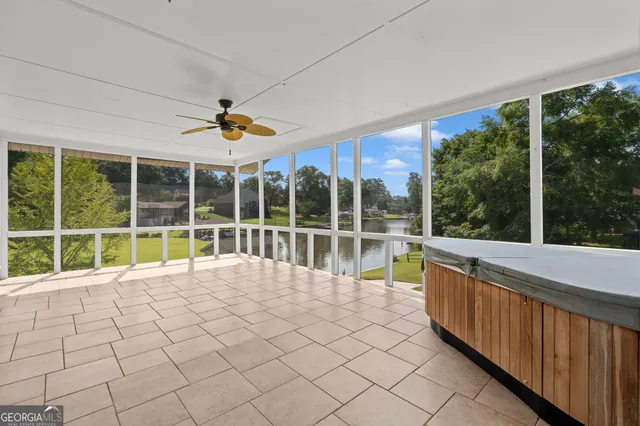 a view of an empty room with a fireplace and cabinet