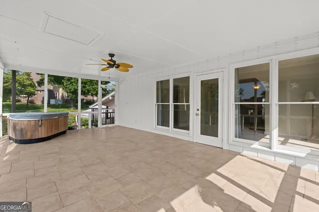 a view of a dining room with furniture and window