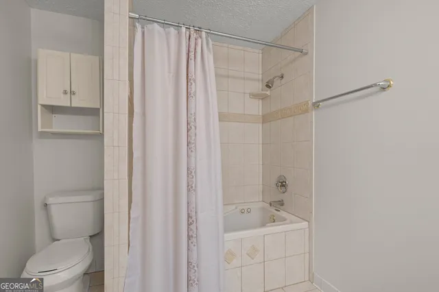 a view of a swimming pool with a lounge chair