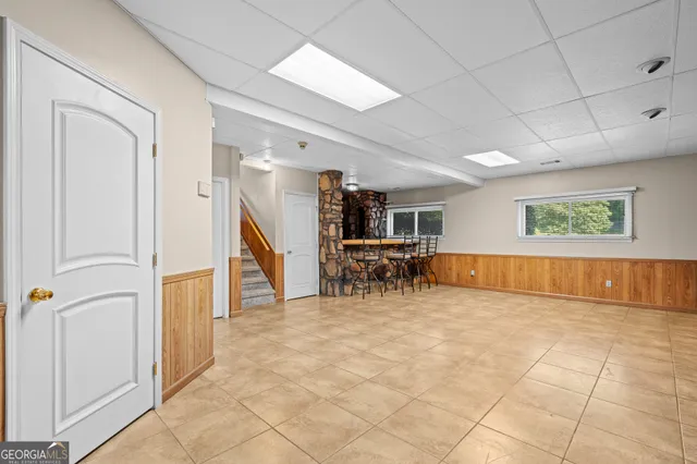 a view of a house with swimming pool and a yard