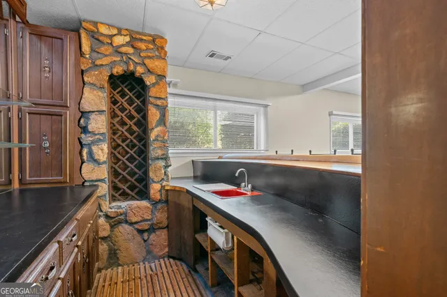 a view of a garden with plants and a lake view