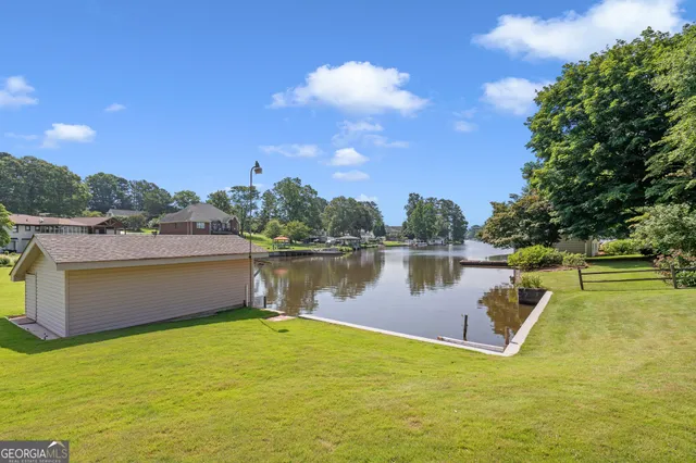 a view of a brick building next to a yard