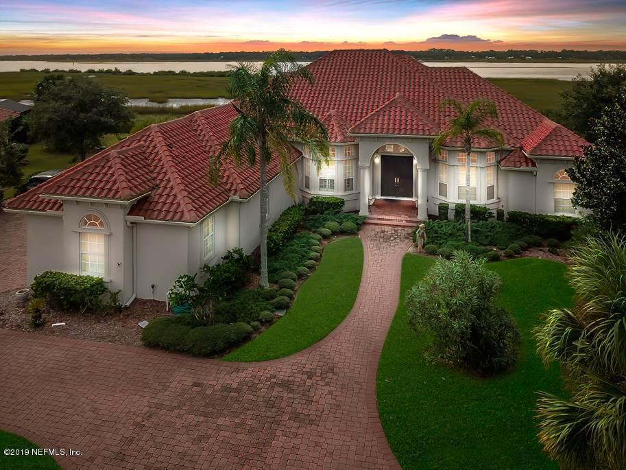 320 View Point Place St. Augustine, FL 32080 - Photo 1 of 33 a front view of a house with a garden